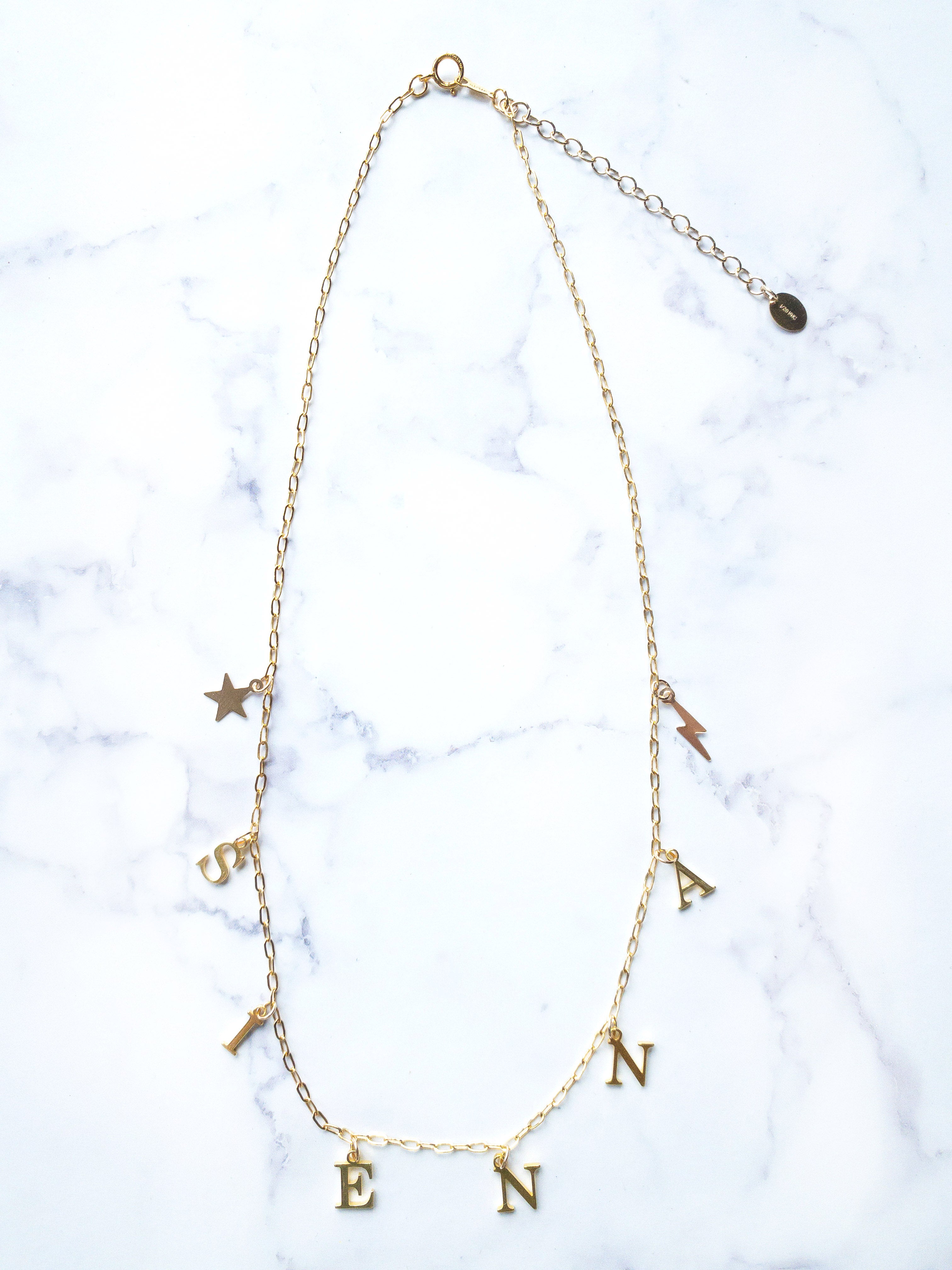Personalised Gold Charm Necklace with Star and Bolt Charms